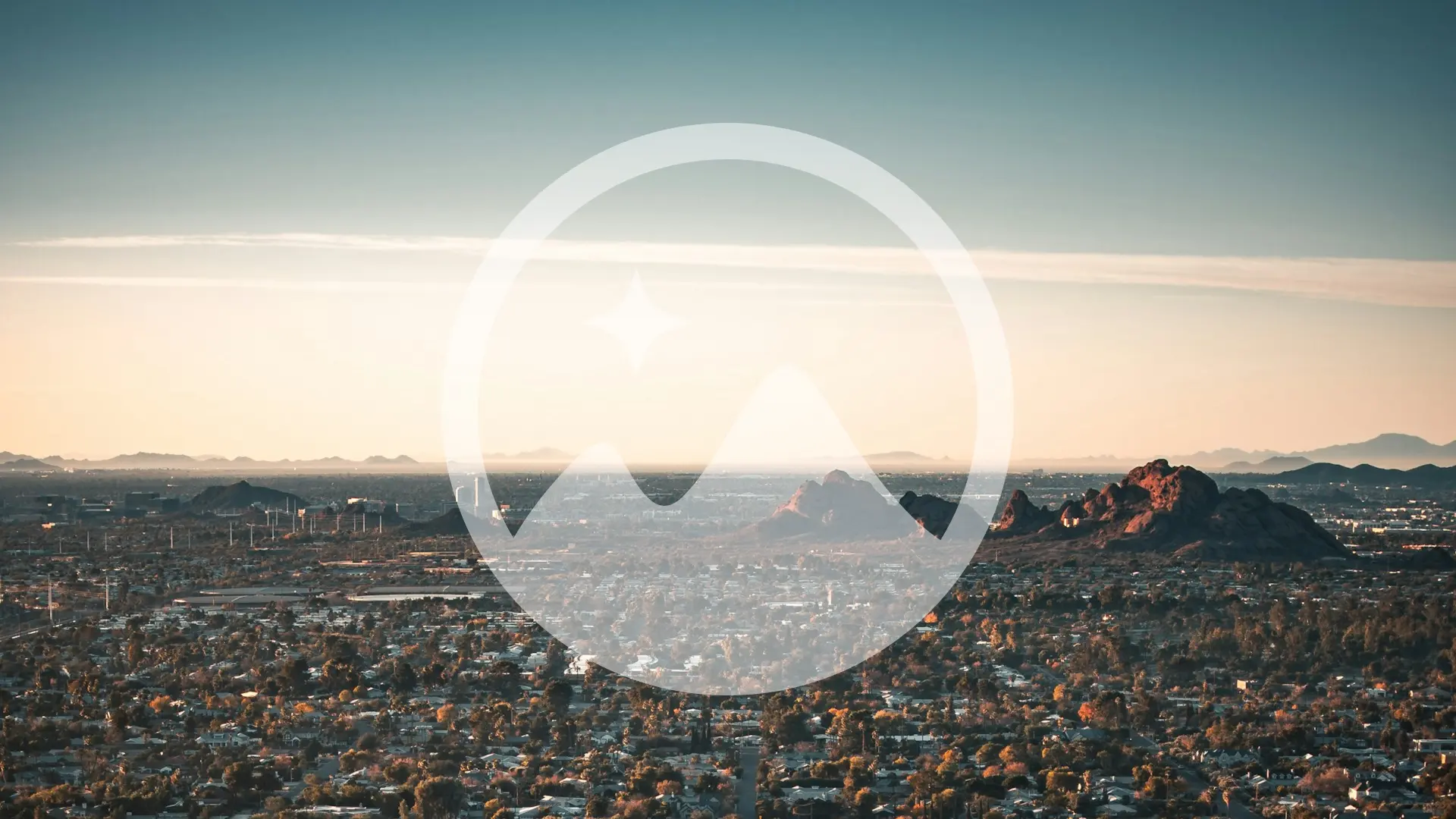 Aerial view of Phoenix and Camelback Mountain at sunset